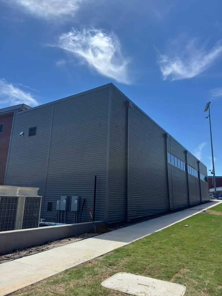 Metal wall cladding on the side of a new commercial building