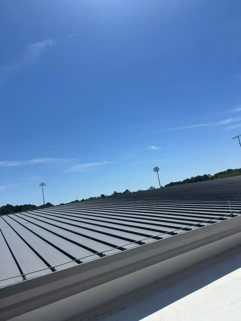 Standing seam metal roof panels on a commercial building