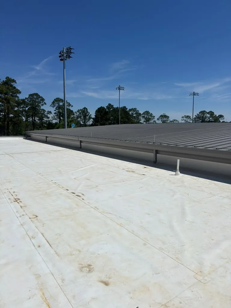 Wide view of a newly installed white TPO roof