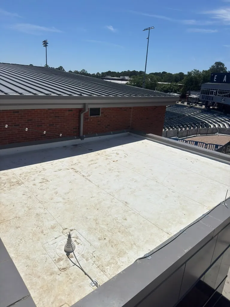 Finished TPO roof with metal coping along the parapet